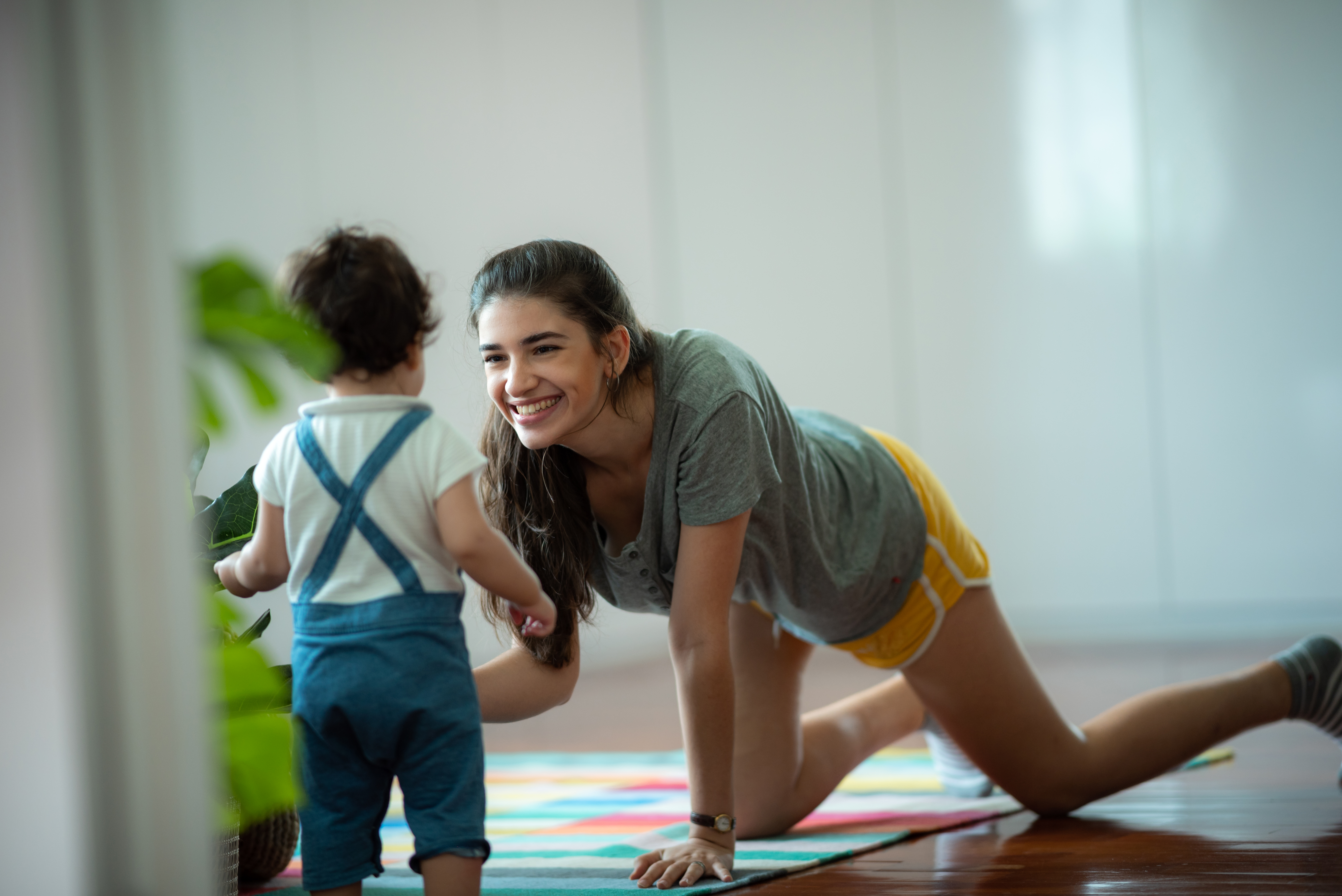 vecteezy_young-mother-and-child-baby-are-happy-at-home-childhood_6907777.jpg